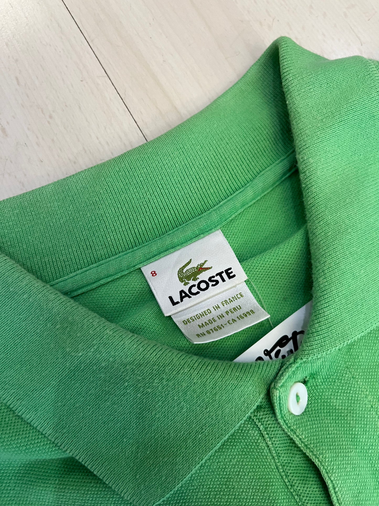 Polo Lacoste verde (H124)