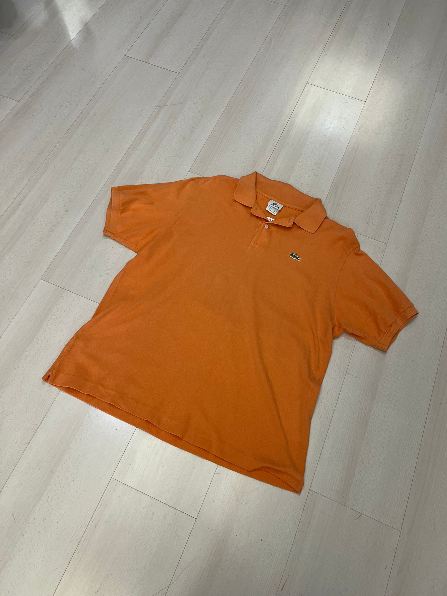 Polo Lacoste arancione (H125)