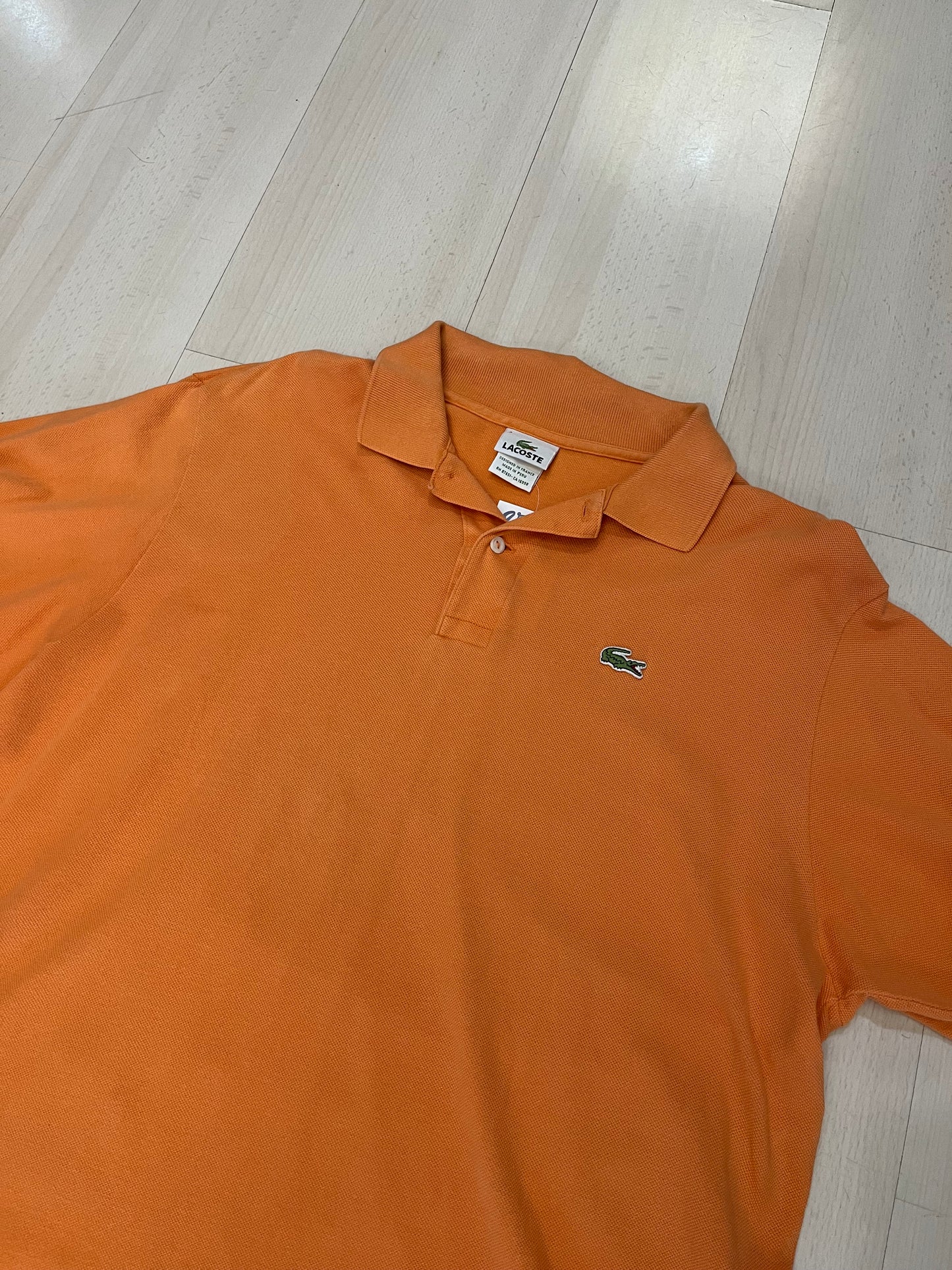 Polo Lacoste arancione (H125)